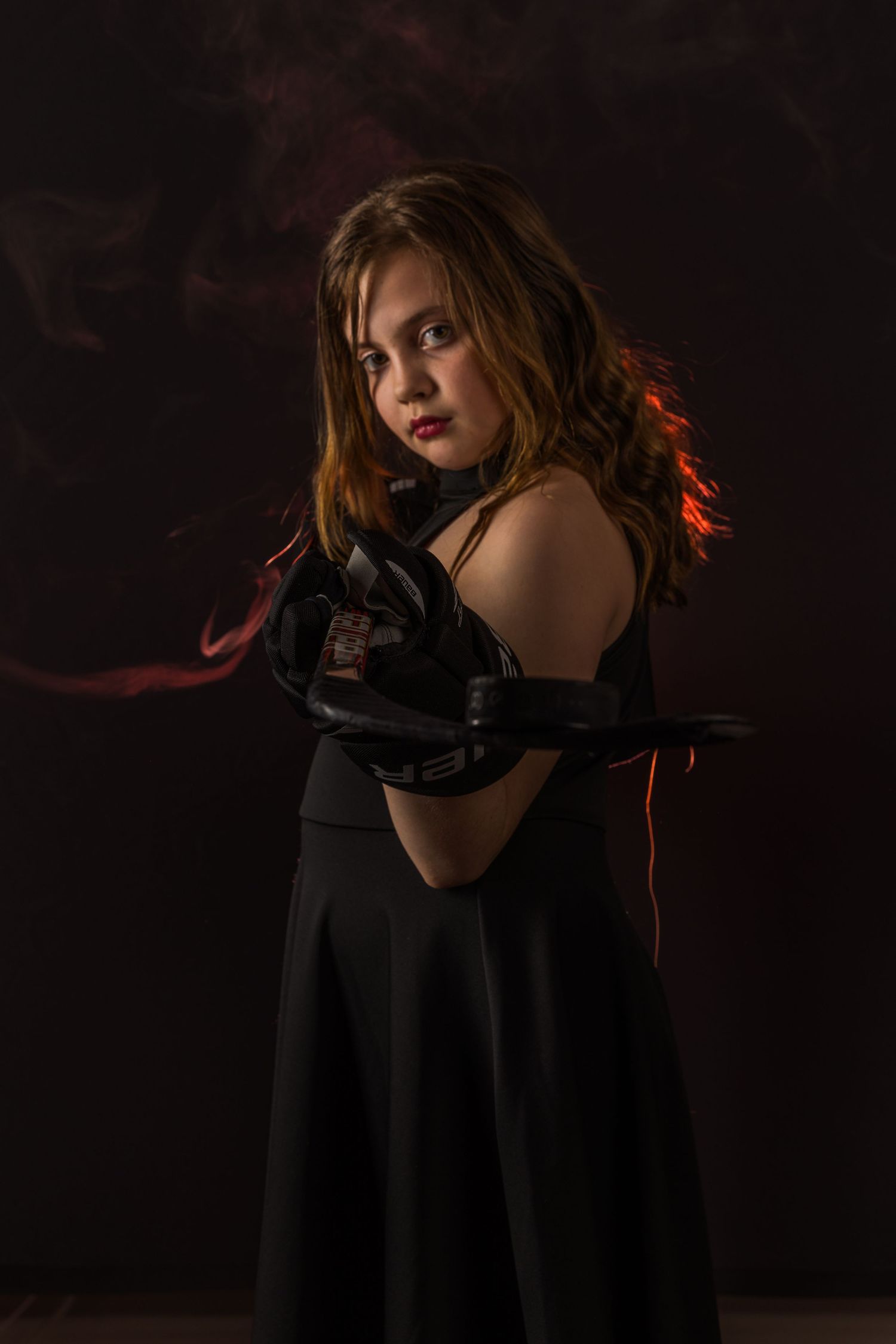 Stoney Creek Sabres Girls hockey player posing during on ice portrait session in Stoney Creek