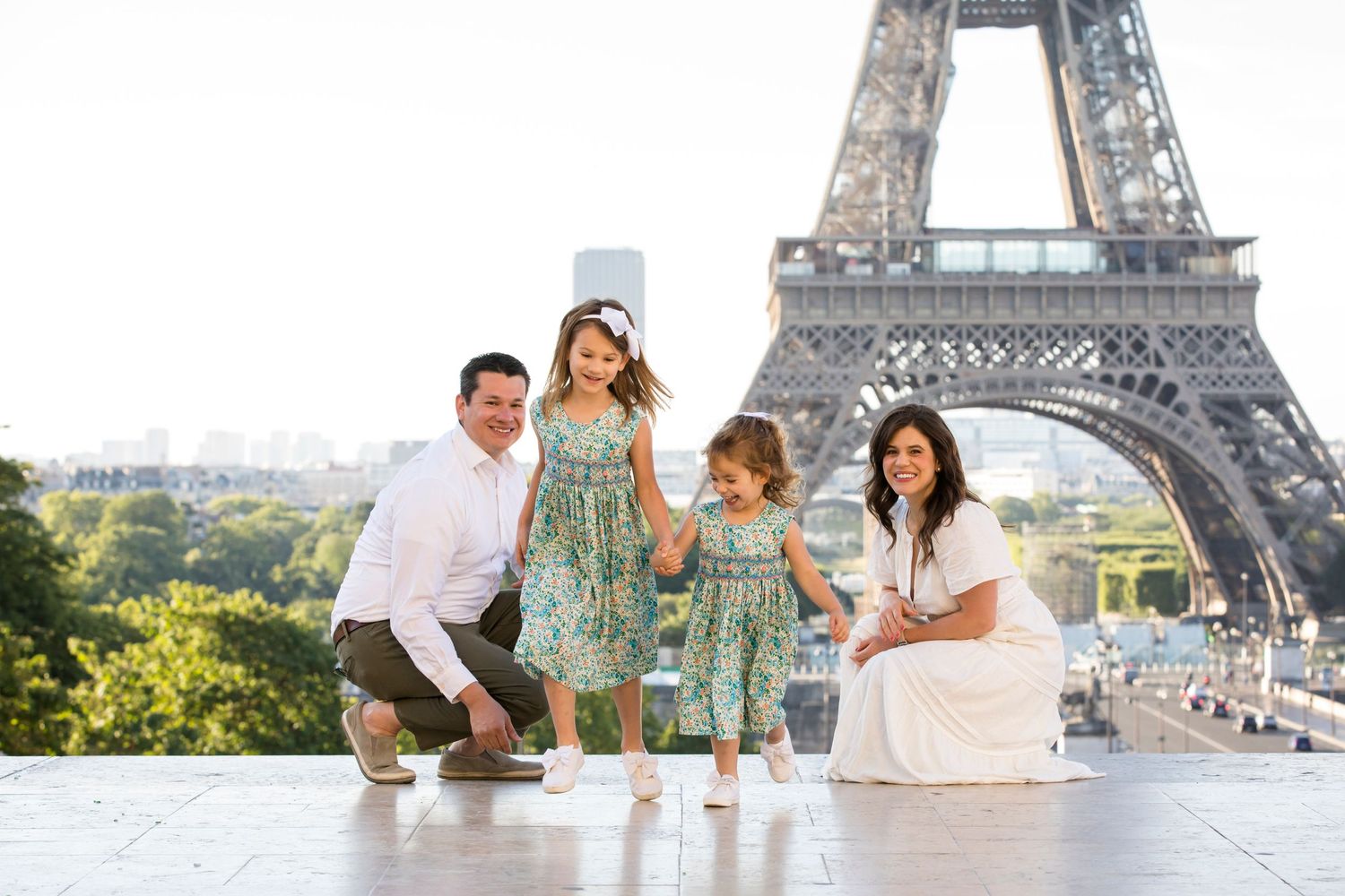 A beautiful family with young kids enjoying an early morning photoshoot at the Eiffel tower with Julien LB Photography
