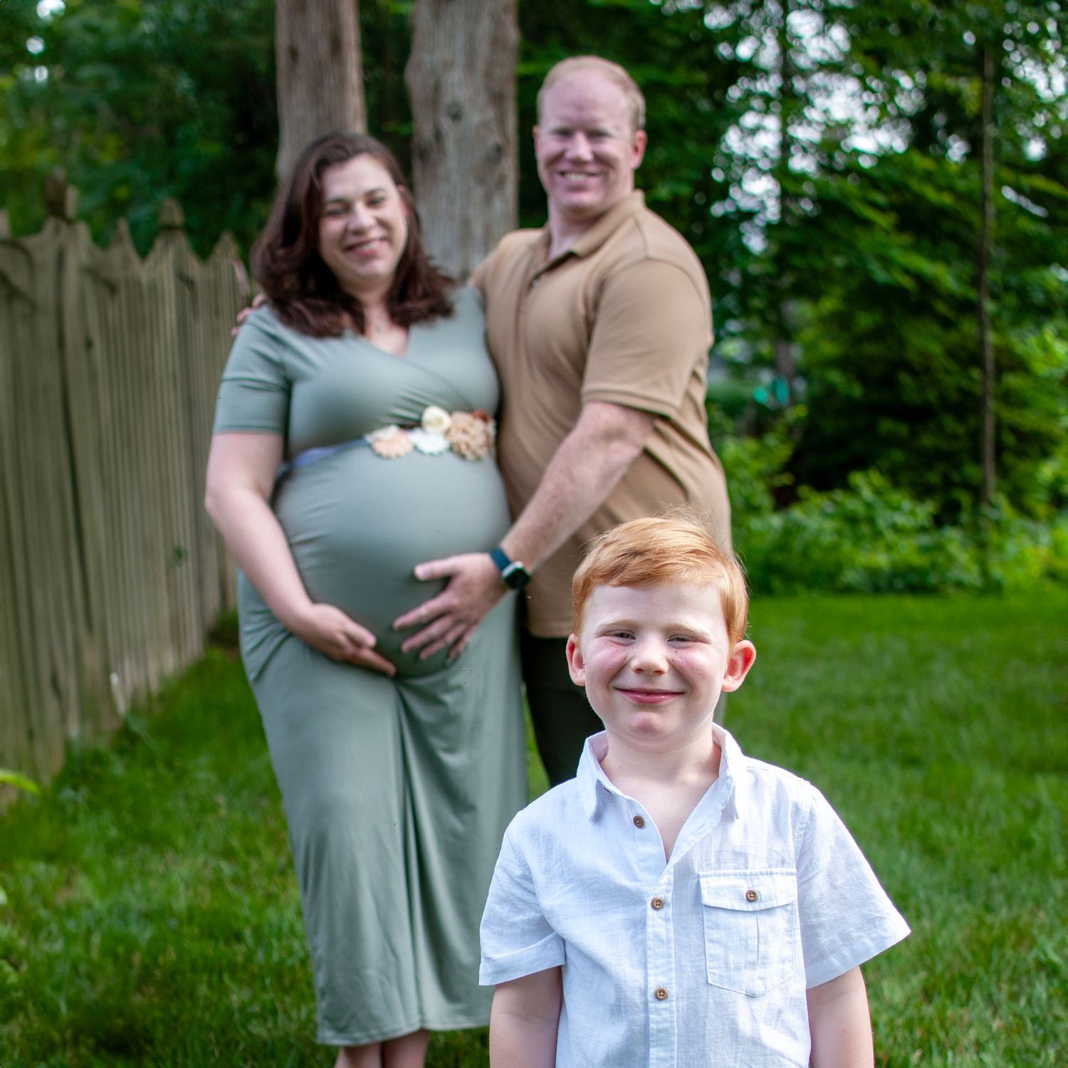 Family photo outdoors maternity
