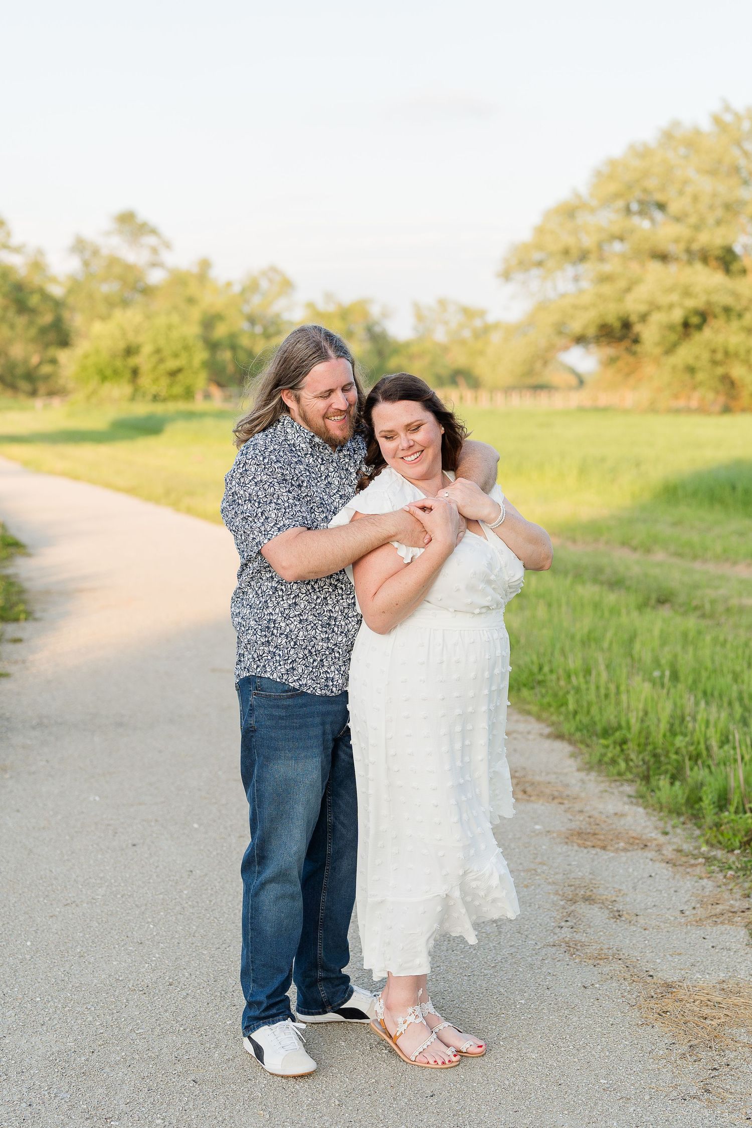 Engaged couple laughing and playfully interacting during their Kenosha engagement session.
