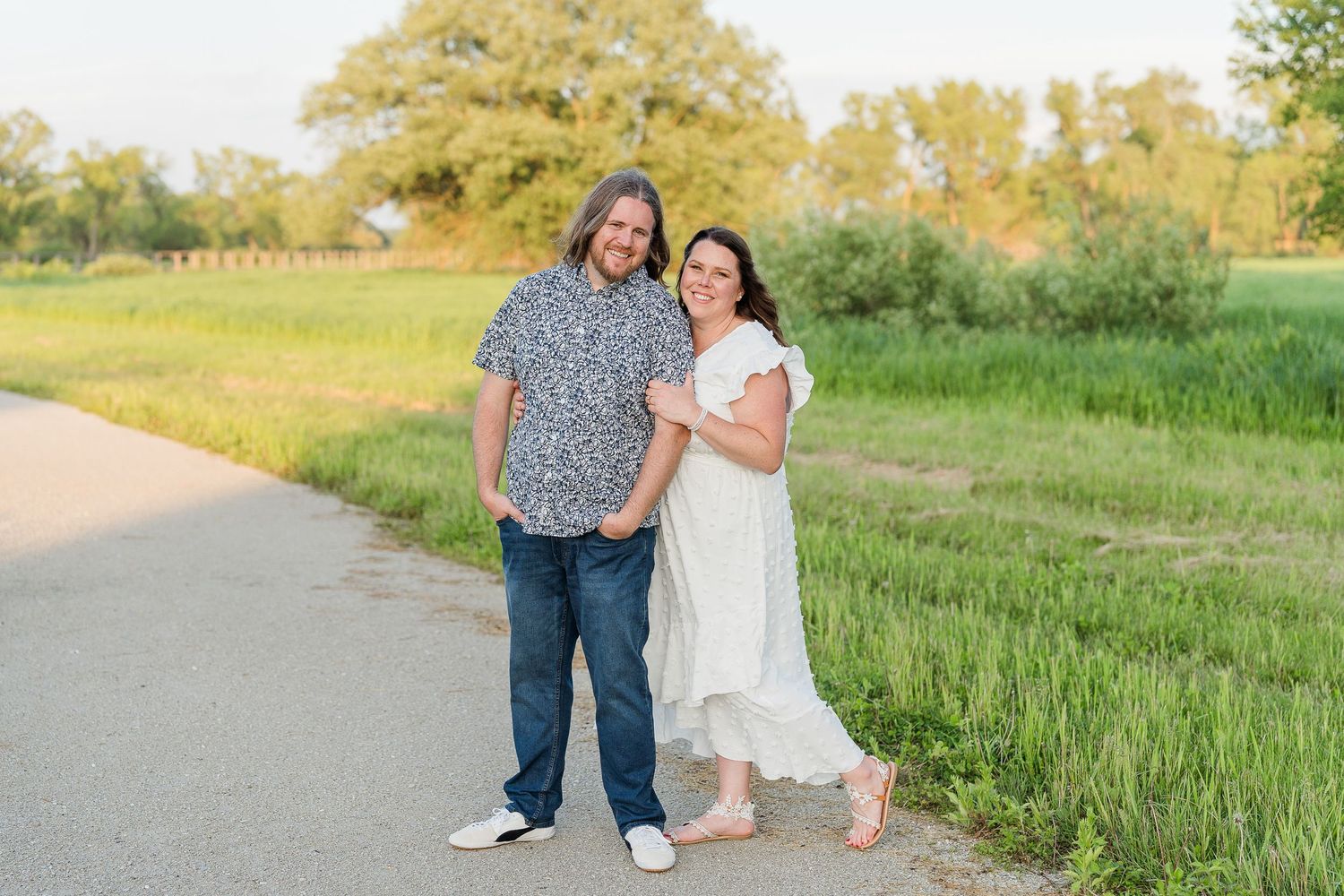 Engaged couple laughing and playfully interacting during their Kenosha engagement session.