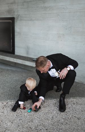 Wedding party members playfully search for something on the ground in a series of candid shots.