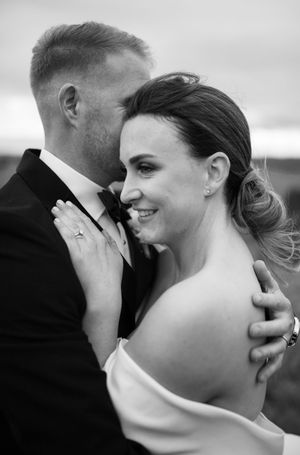 Intimate black and white close-up portraits of couple sharing tender moments.