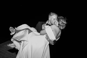 Black and white artistic wedding photos showing tender moments between newlyweds.