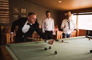 Multiple shots of people playing pool during a formal event in an indoor venue.