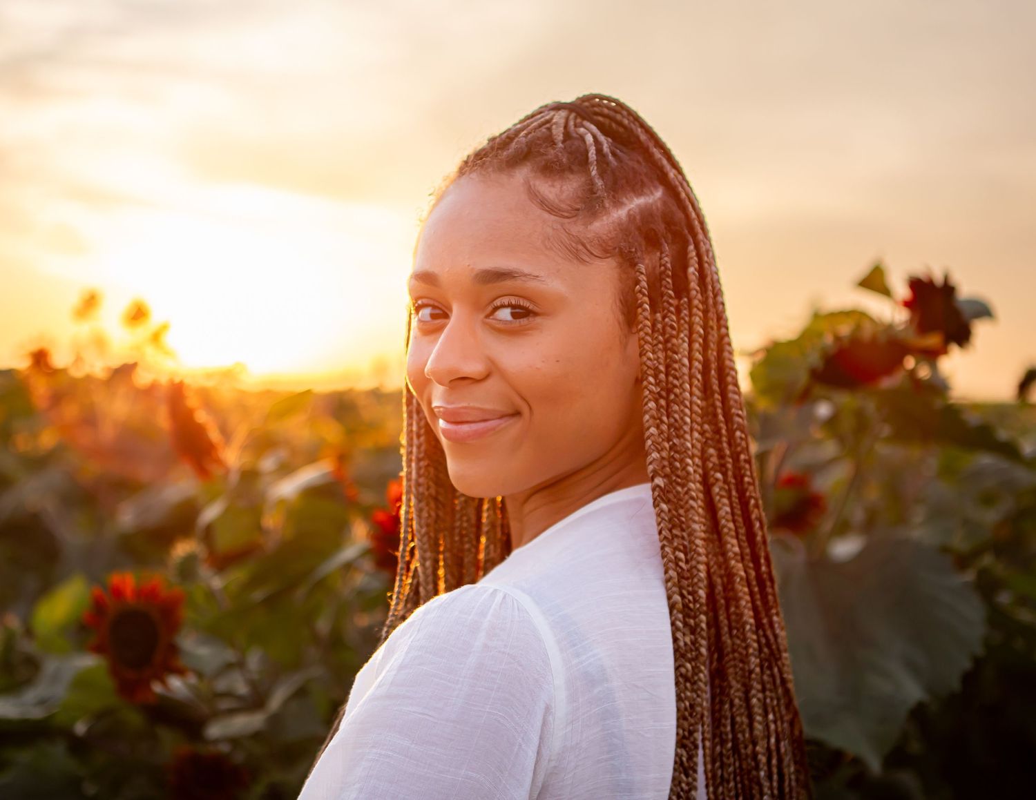 Portrait session at sunset with warm golden lighting.