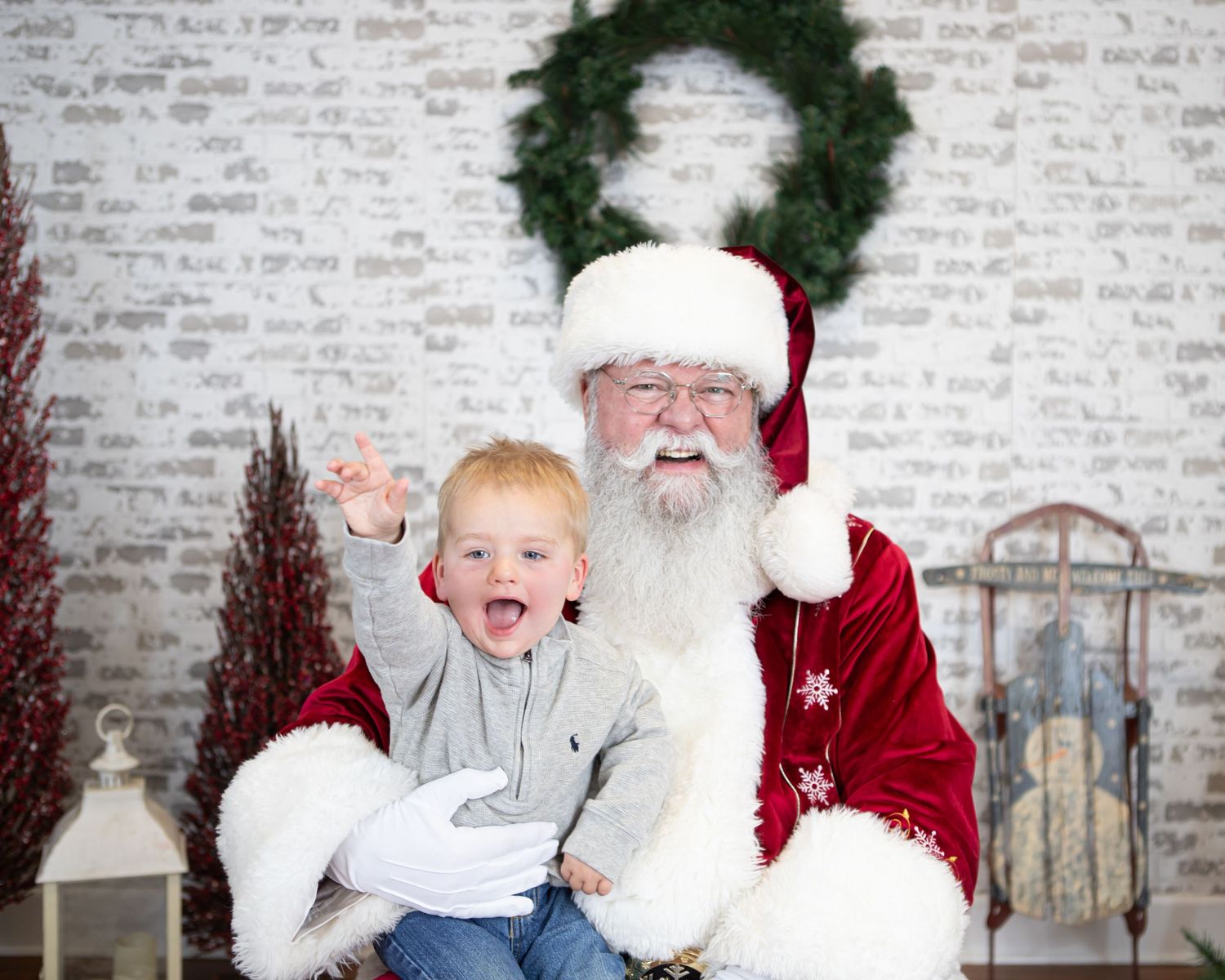Candid holiday portrait moment against festive backdrop with decorations.