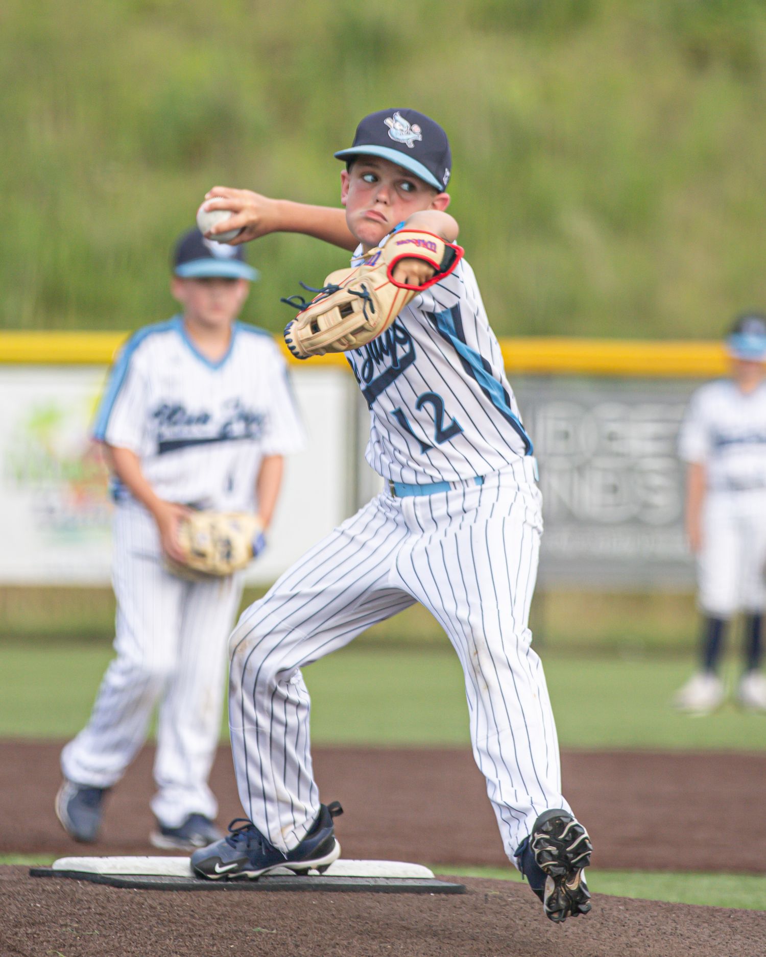 Baseball fielding sequence showing defensive plays on dirt infield.