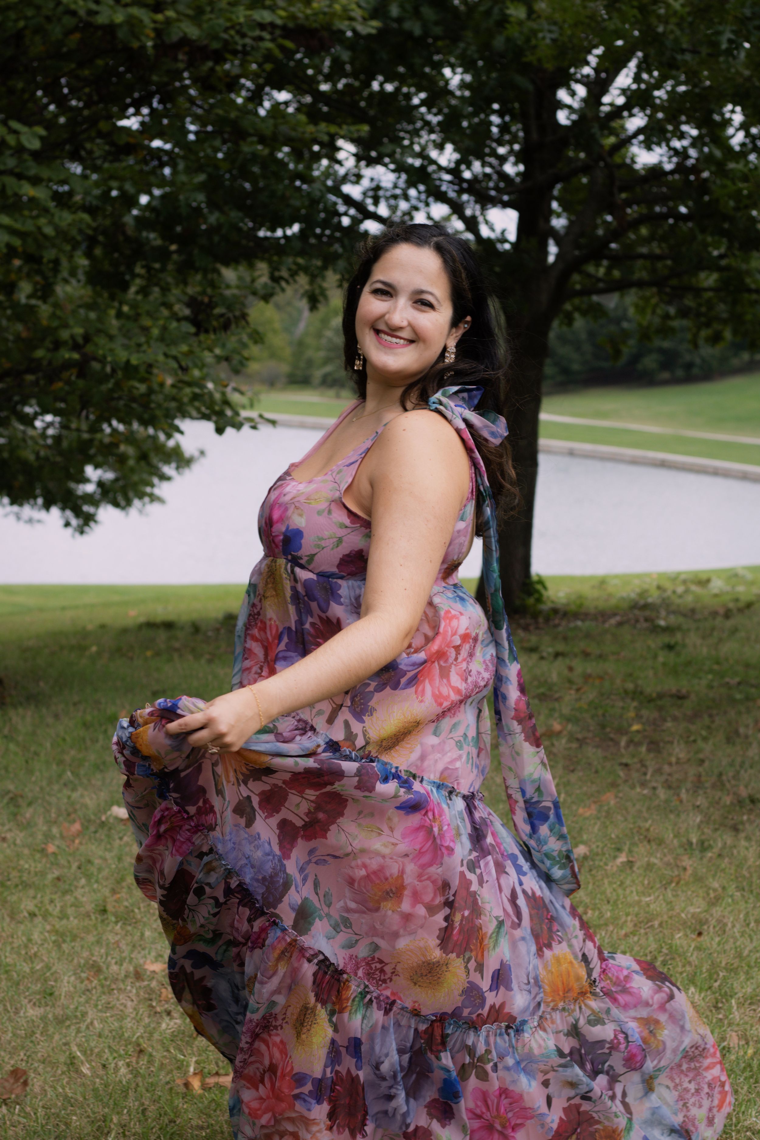 A woman twirling her dress outside for a birthday photoshoot in St. Louis, Missouri