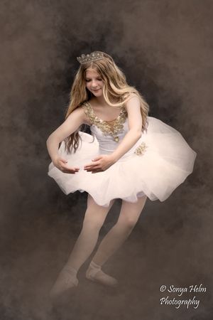 Artistic dance photography sequence showing graceful movements in a white tutu dress against a dark background.