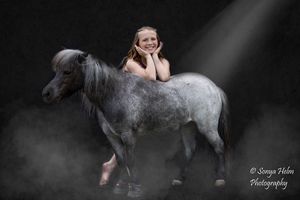 Dramatic black and white photo sequence featuring dance movements with miniature ponies.