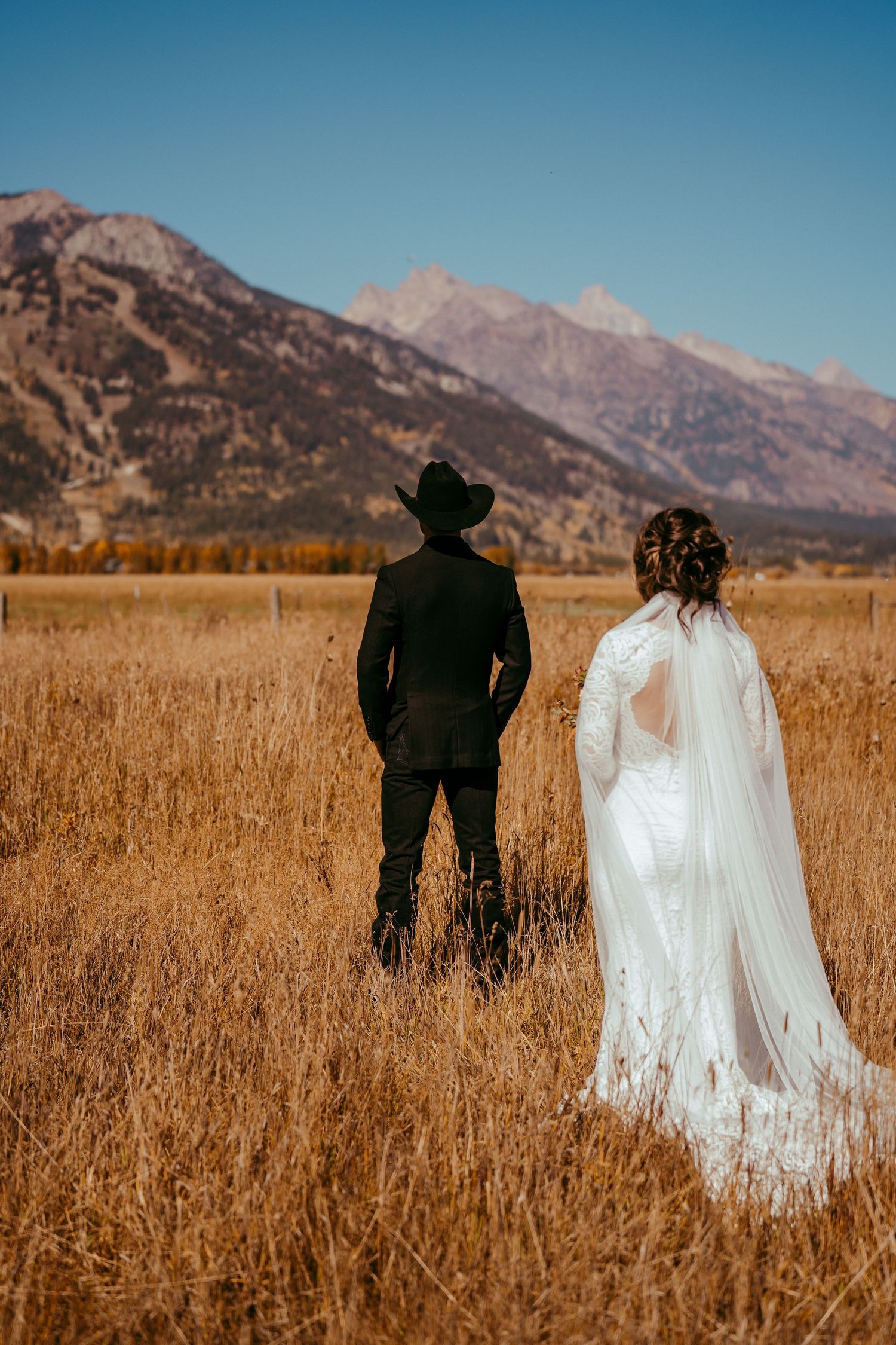 Golden hour sunlight creates a warm glow over the scenic mountain backdrop