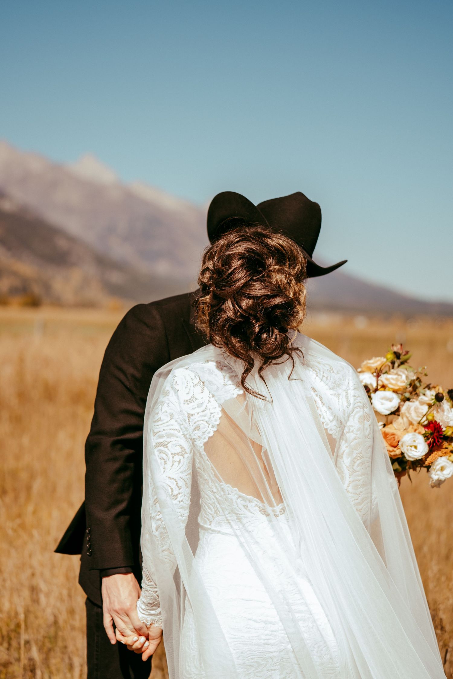 Golden hour sunlight creates a warm glow over the scenic mountain backdrop