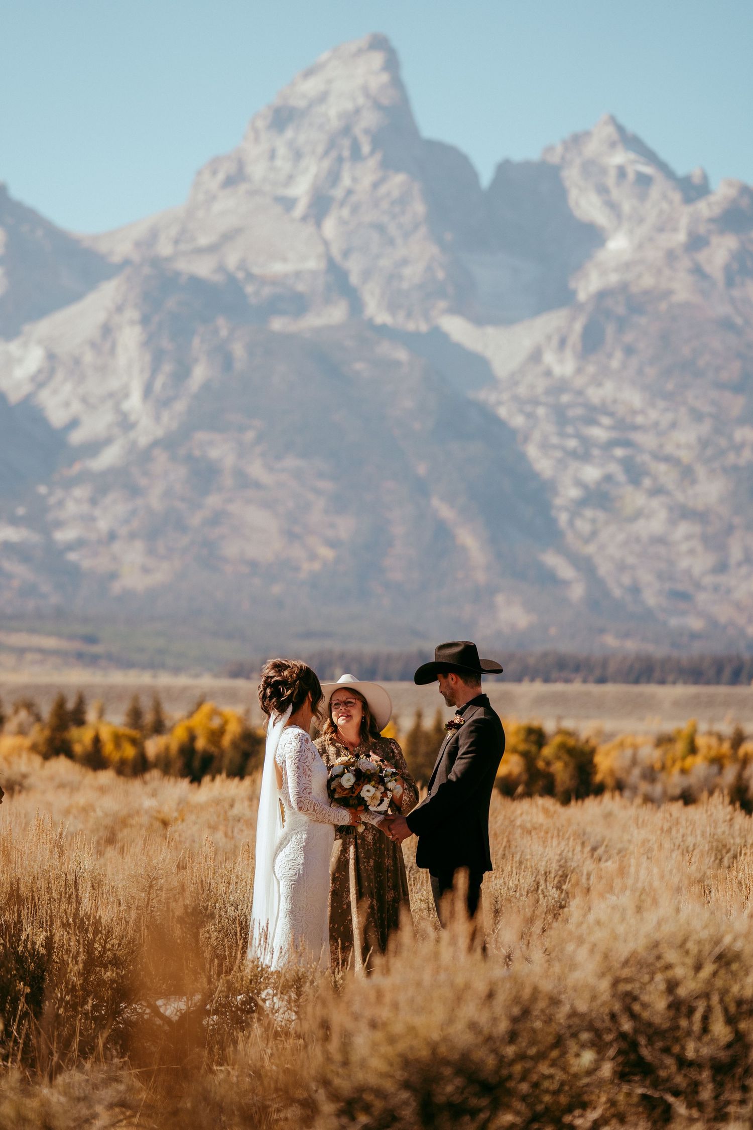 Golden hour sunlight creates a warm glow over the scenic mountain backdrop