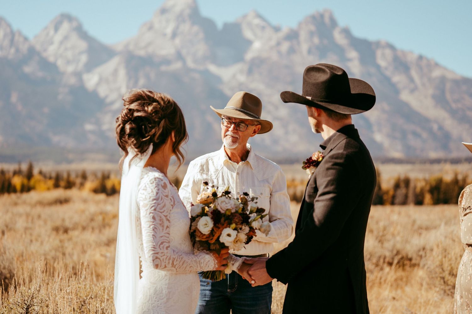 Golden hour sunlight creates a warm glow over the scenic mountain backdrop