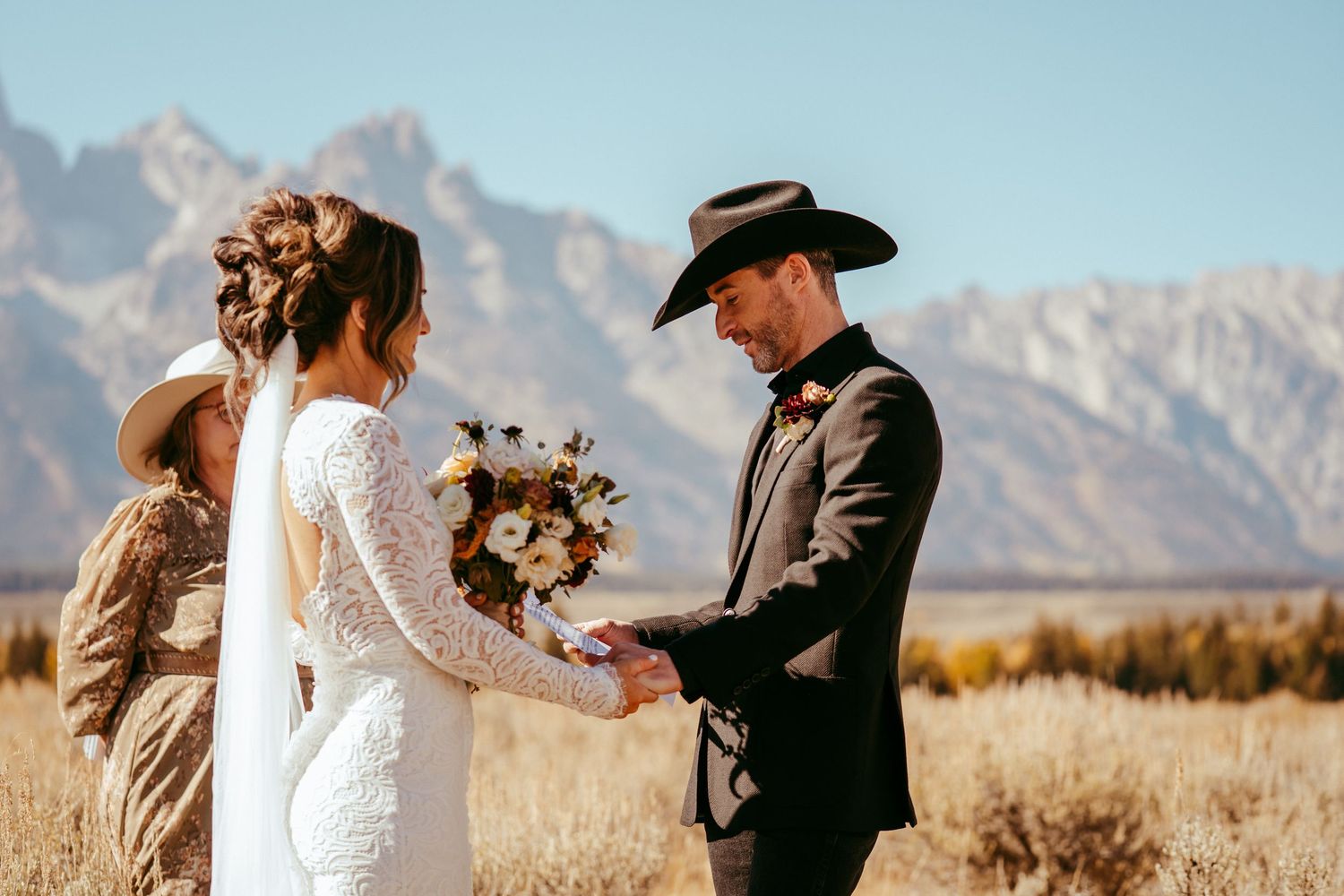Golden hour sunlight creates a warm glow over the scenic mountain backdrop