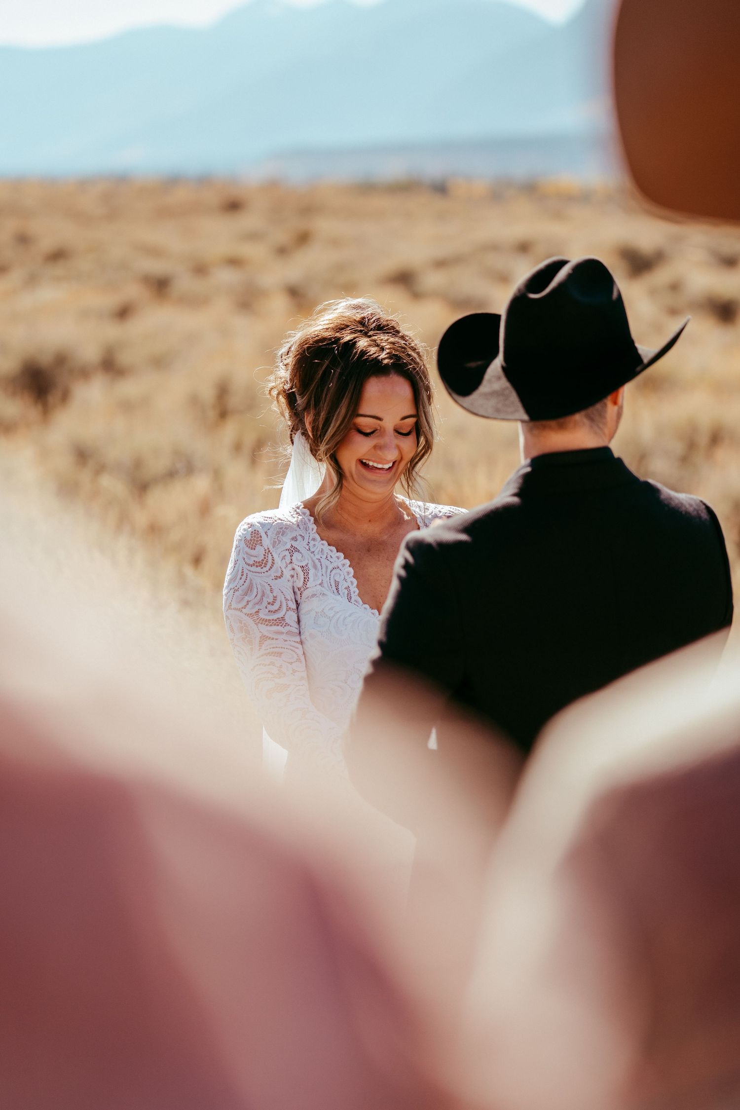 Golden hour sunlight creates a warm glow over the scenic mountain backdrop