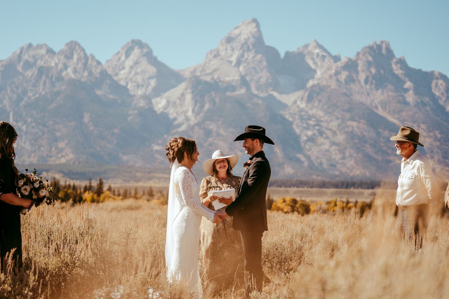 Golden hour sunlight creates a warm glow over the scenic mountain backdrop