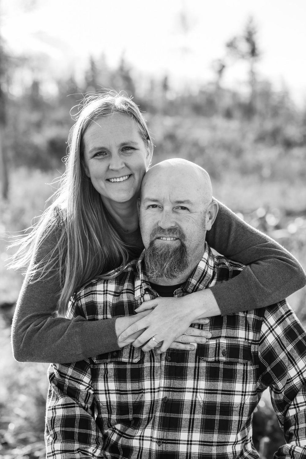 couple posing lovingly in black and white