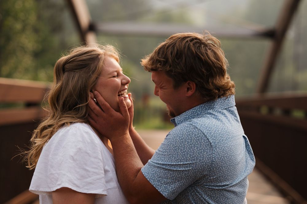 engagement photoshoot of Blake and Malania embracing and laughing