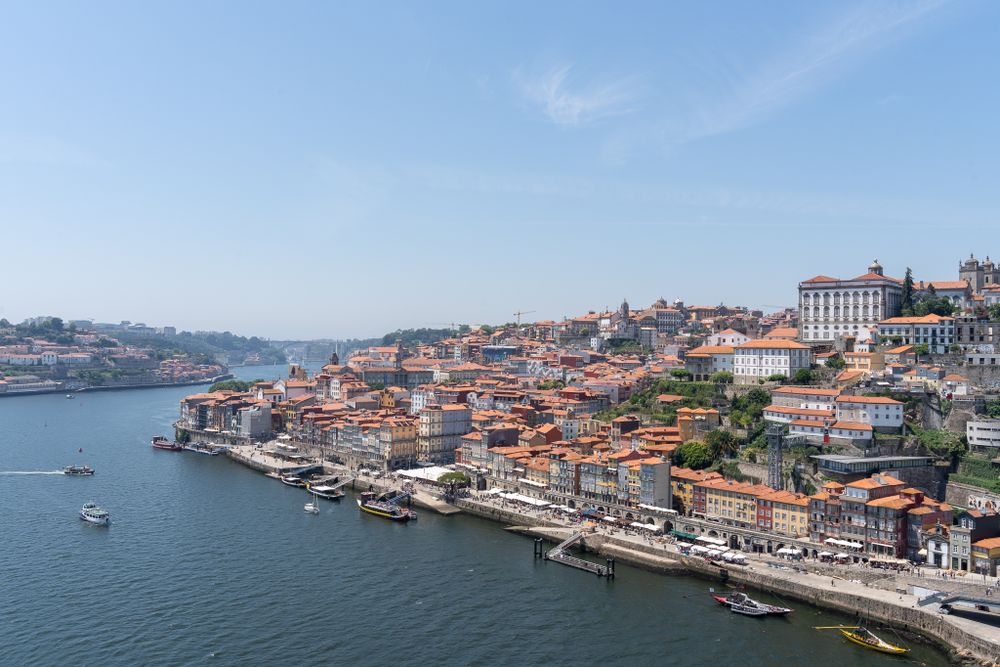 Scenic view of Porto's historic waterfront with traditional buildings cascading down to the Douro River.