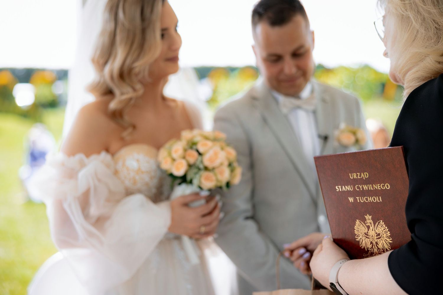 Wedding ceremony closeup showing Polish passport and bouquet during the proceedings.