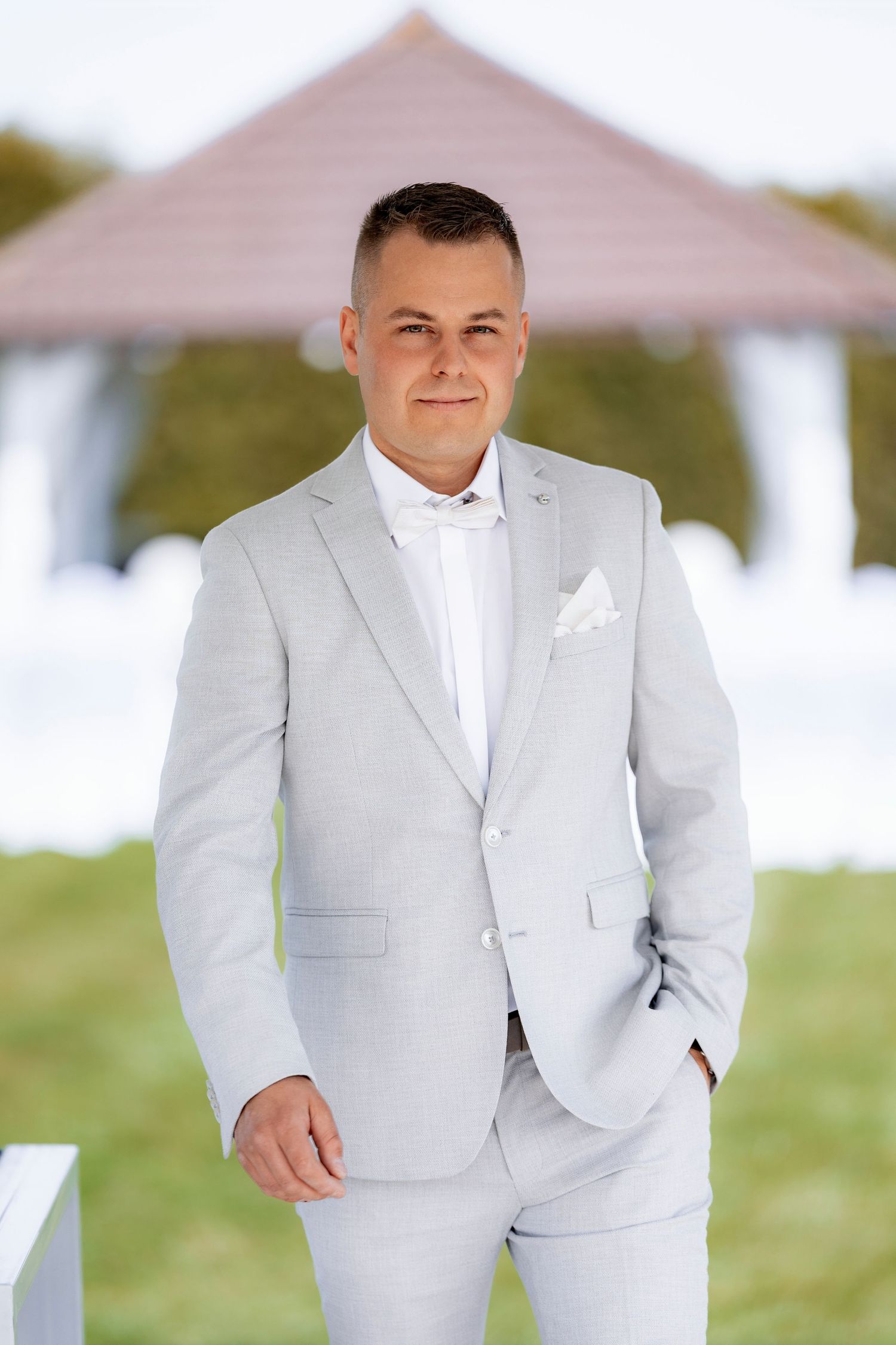 Elegant light grey suit and white shirt combination for a formal occasion.