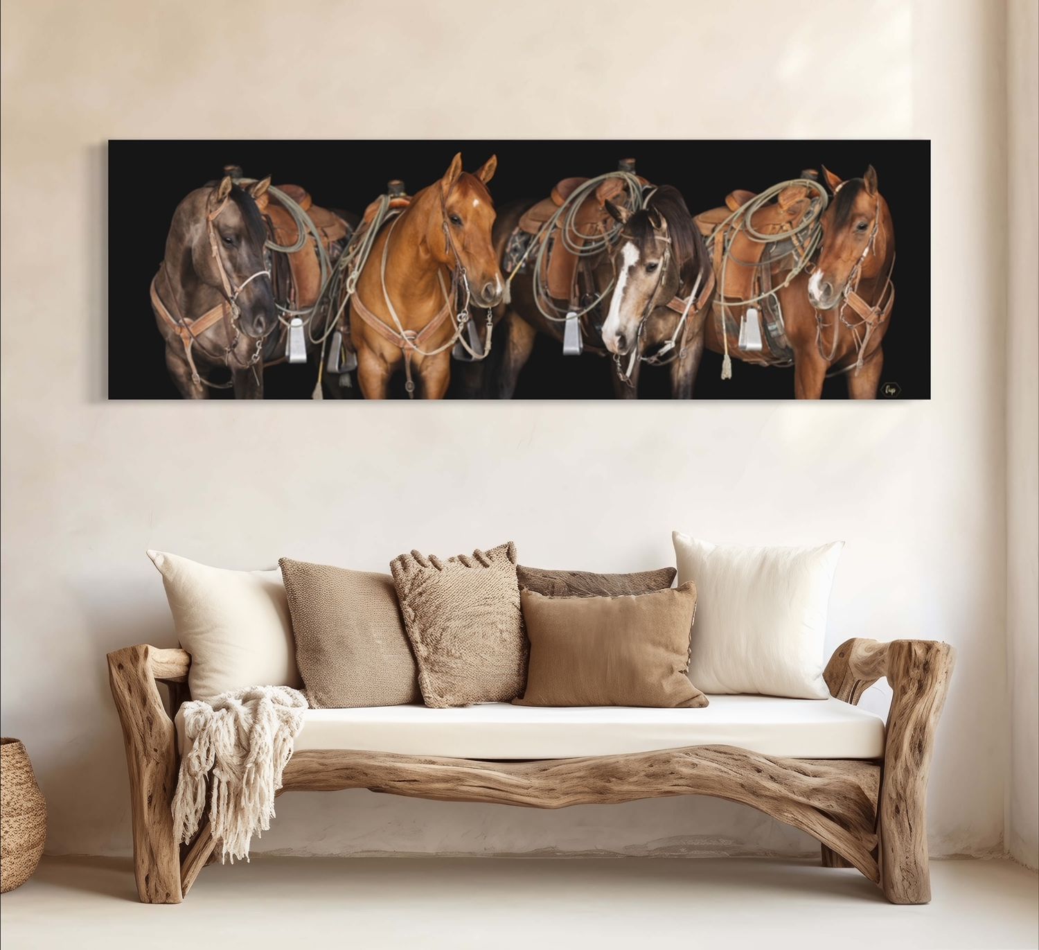 Panoramic art of multiple horses in warm brown tones displayed above rustic wooden bench.
