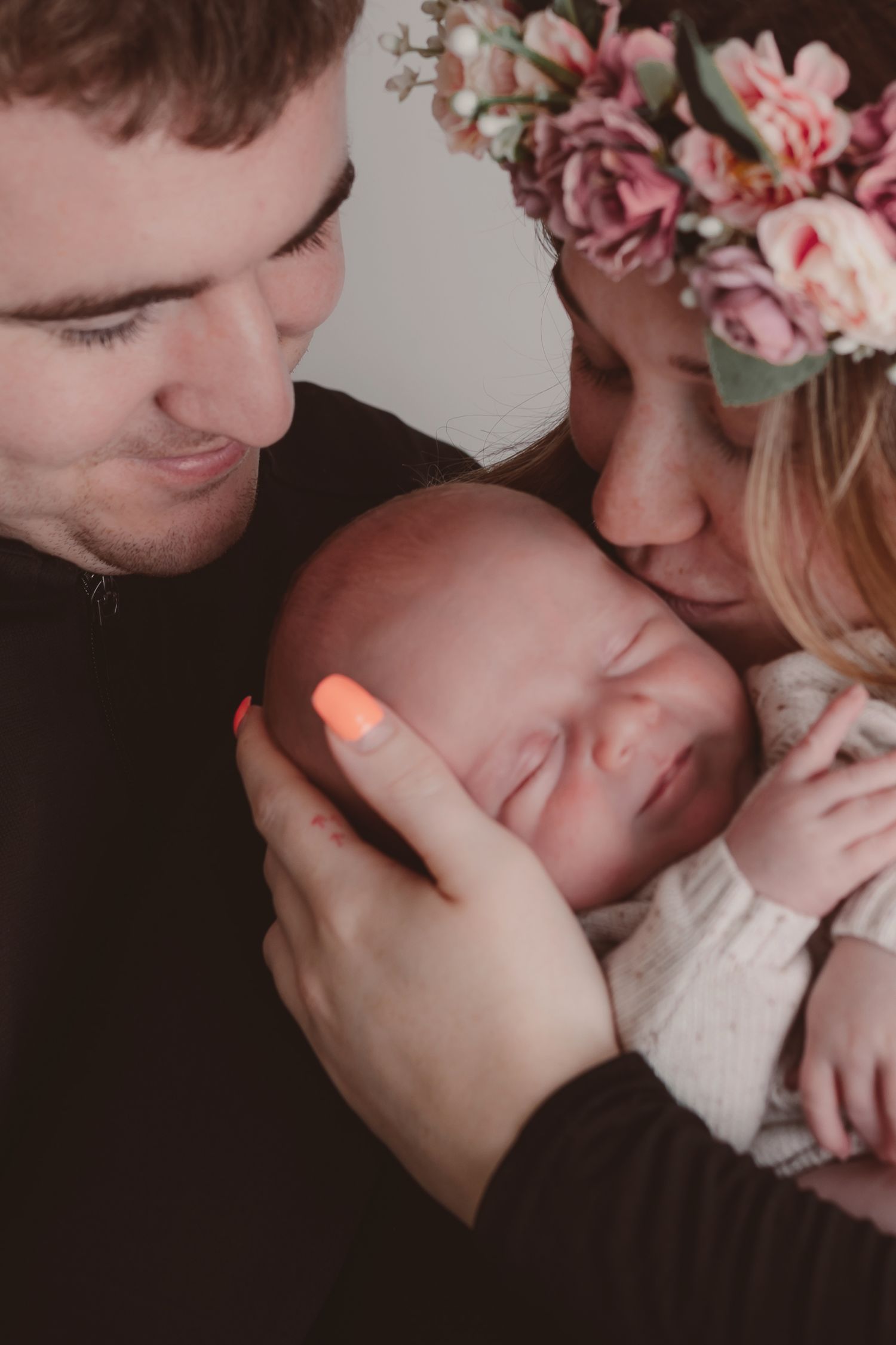 Tender family moment with newborn baby wearing floral crown. Photographer. Hull. East Yorkshire. Photography