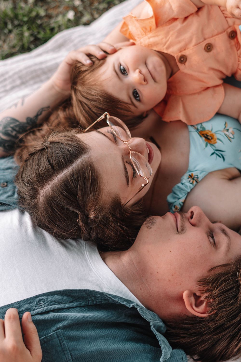 Intimate family portraits captured from above showing loving interactions.