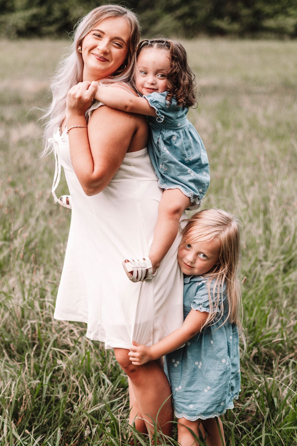 Sweet candid moments captured during an outdoor family photo session.