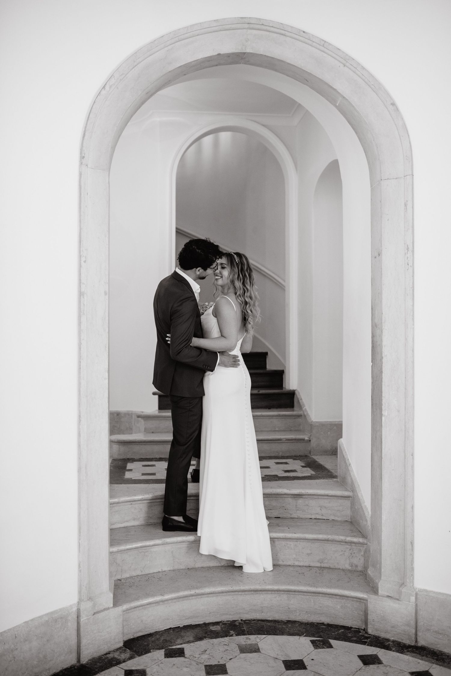 Camelia Gardens Destination Wedding. Black and white portrait of bride and groom inside the palace.