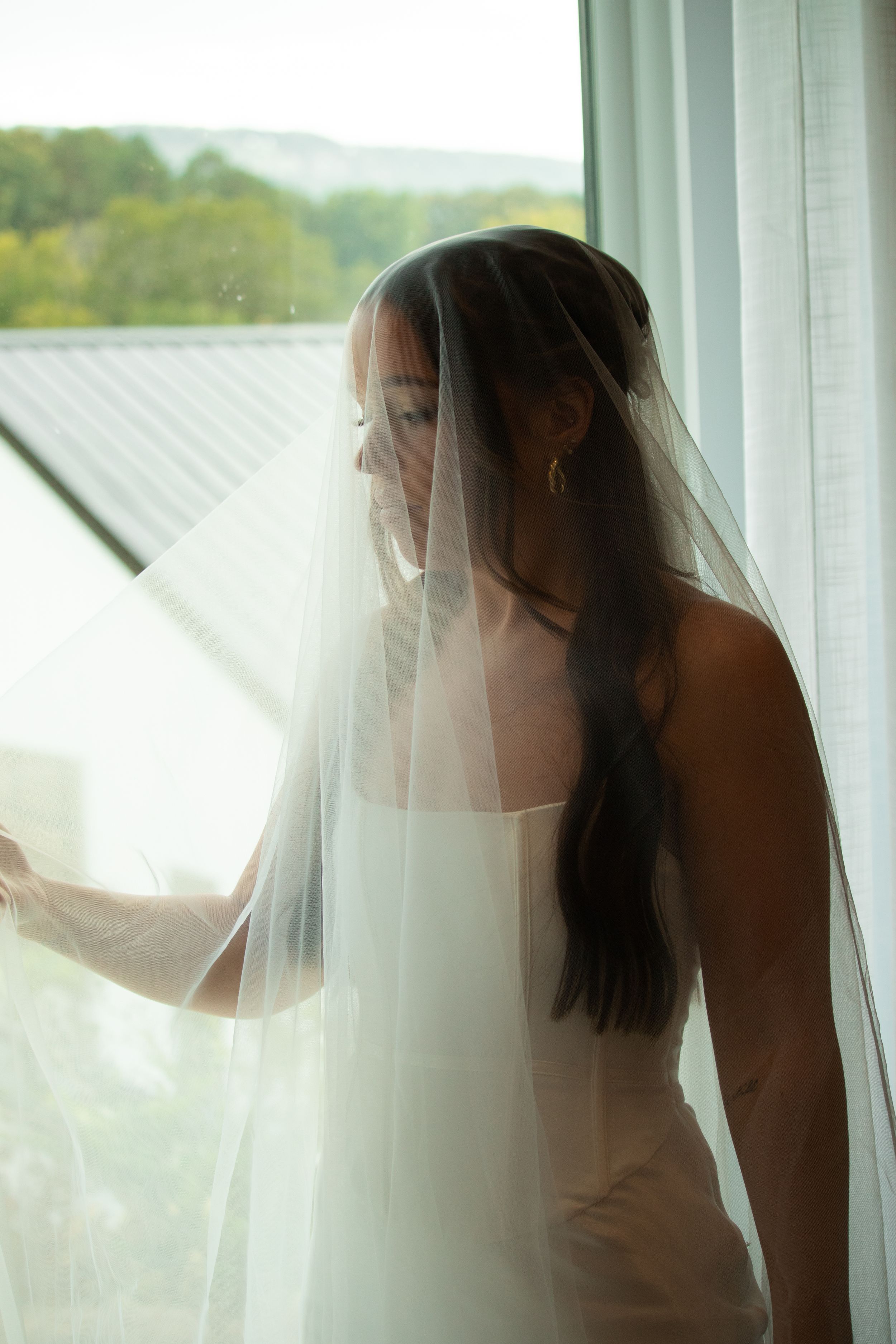 Artistic sequence of a bride behind sheer white curtains creating an ethereal bridal portrait effect.