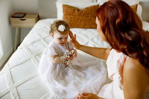 A series of connected photos showing a bride getting ready in a white wedding dress.