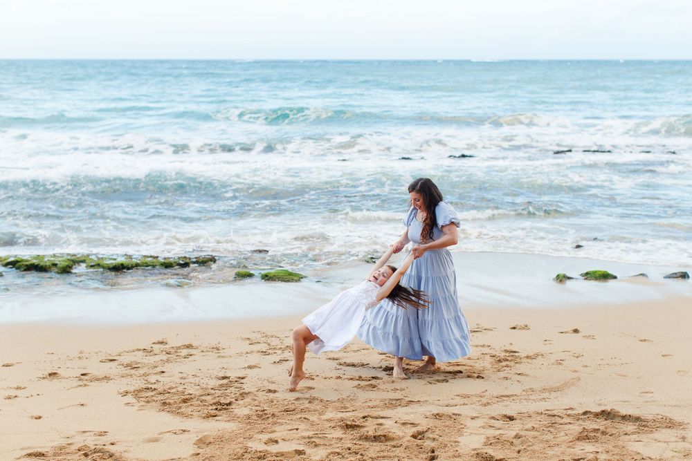 Portrait of a mother and daughter on the beach. San Juan, Puerto Rico.