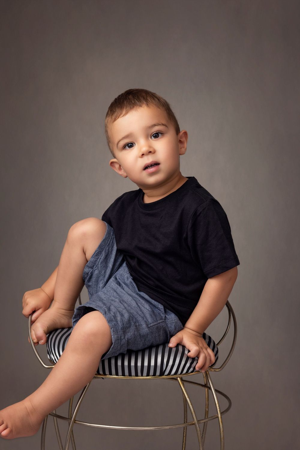 Two year old fine art portrait , sitting on a antique chair
