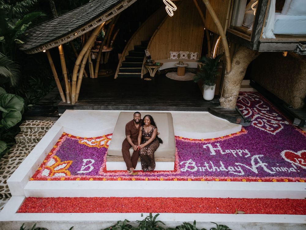 Birthday drone photography session at Bambootel Bali featuring a flower pool setup.