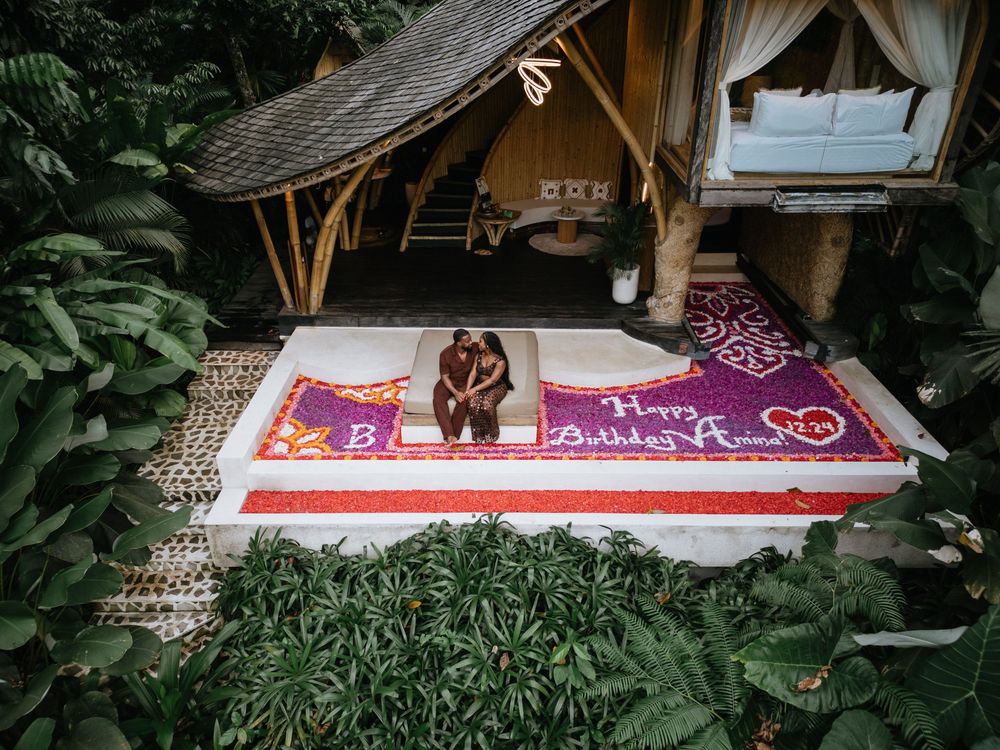 Birthday drone photography session at Bambootel Bali featuring a flower pool setup.