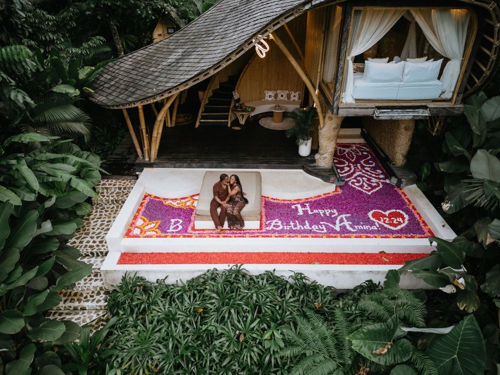 Birthday drone photography session at Bambootel Bali featuring a flower pool setup.