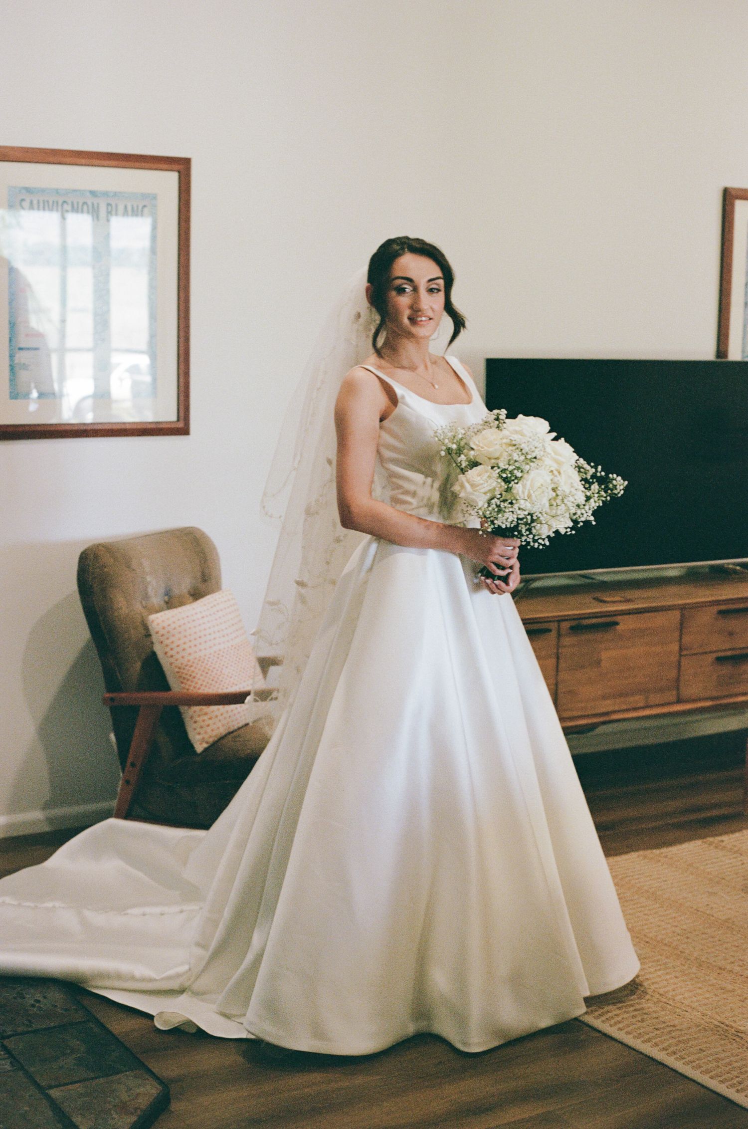bride holding bouquet in wedding dress at two rivers winery wedding