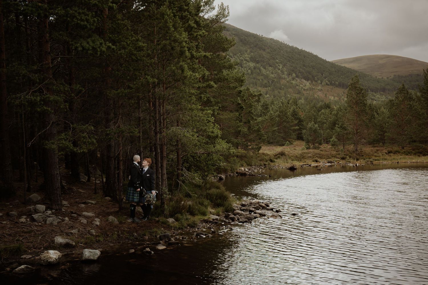 Couple celebrating their intimate castle elopement in Scotland with romantic portraits outside a historic Scottish castle.