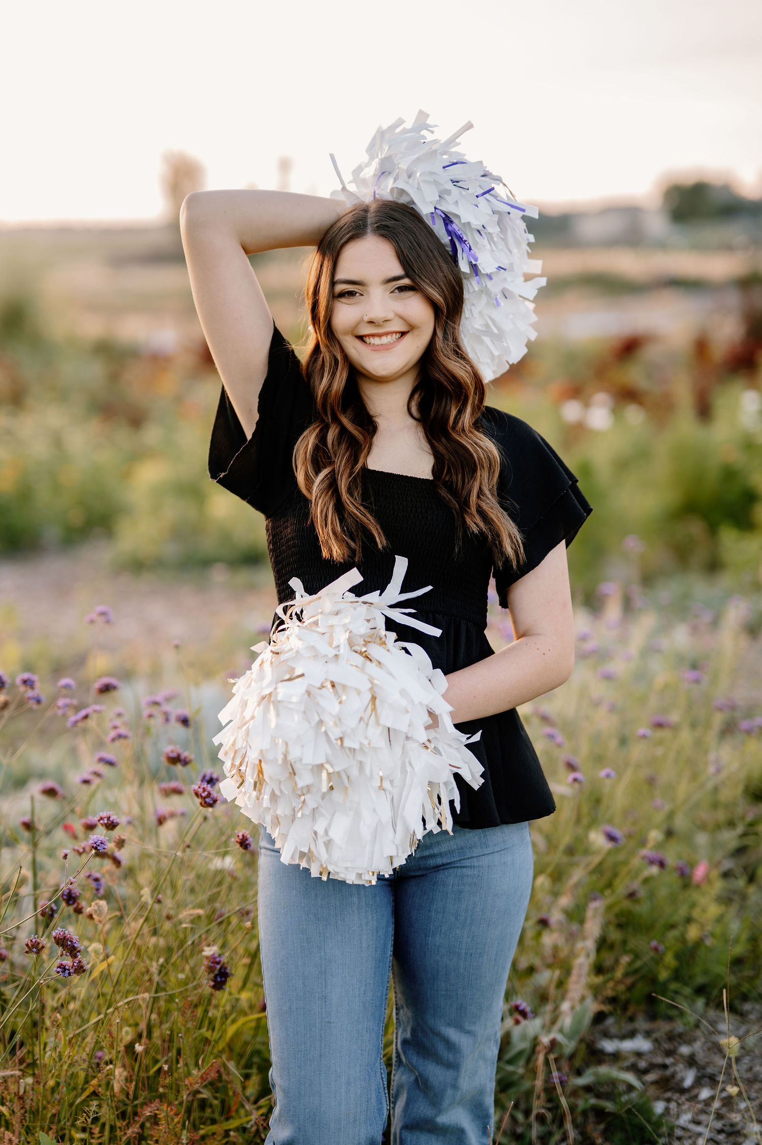 2026 senior stands in wildflowers at Haven Flower Farm in Tri-Cities, WA
