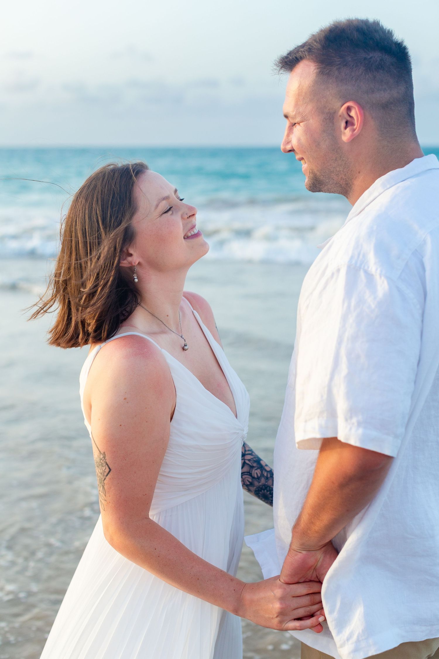 Couples portrait on the beach in Isla Verde, Carolina, Puerto Rico.