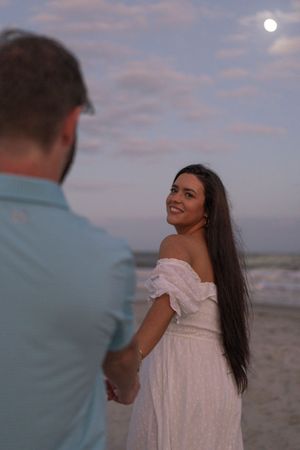 Sunset engagement session portraits at Great Dunes Park, Beach engagement session after the sun has set