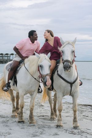 Romantic horseback ride along Driftwood Beach after a surprise proposal