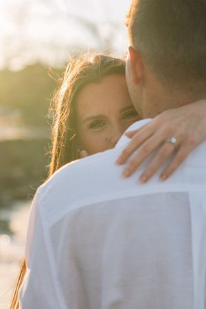 Romantic engagement location, couple shares an embrace on Jekyll Island during portrait session