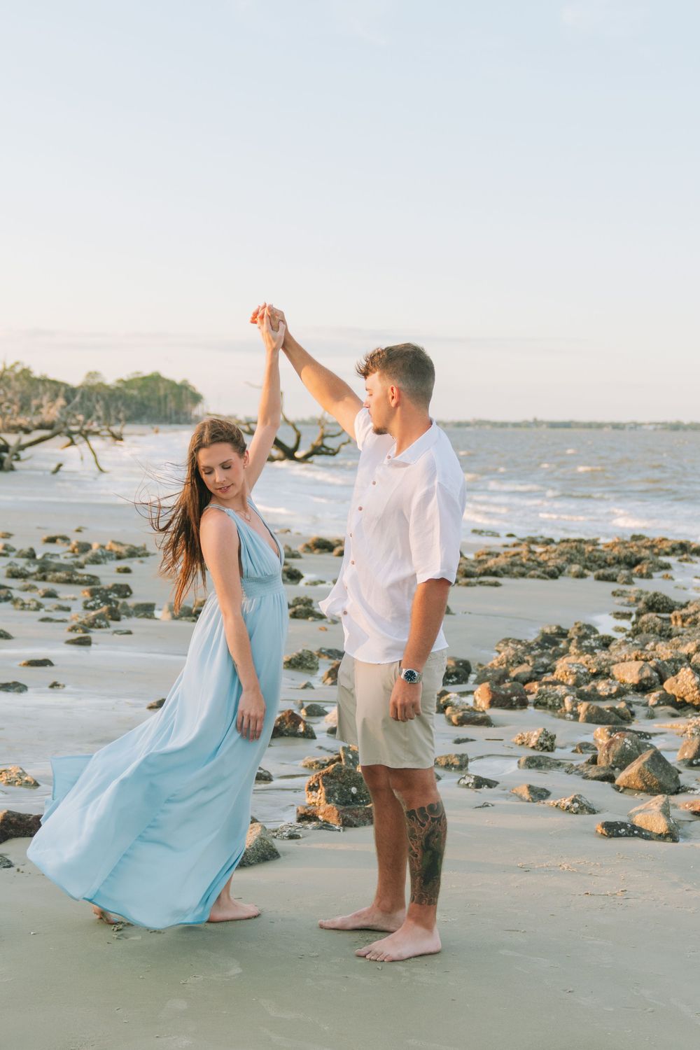 Romantic proposal location on Jekyll Island with ocean and driftwood views