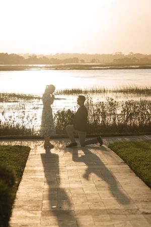 Surprise proposal photography during engagement session on Sea Island near the resort and Cloister Inn