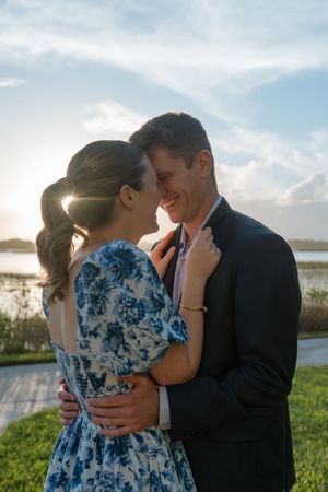 Editorial engagement session with young couple close to kissing after she's agreed to marry her boyfriend during proposal in golden isles