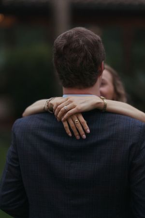 Newly engaged couple embracing during planned proposal engagement portraits at dusk on Sea Island, Georgia with Lindy Rebro, cinematic